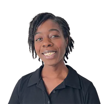 A professional portrait of osteopath Naomi Nekesa, smiling and wearing blue clinical scrubs, set against a plain background.